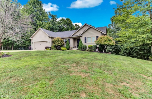 view of front of property with a garage and a front yard