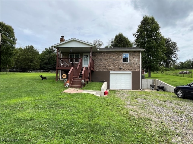 view of front facade with a garage and a front lawn