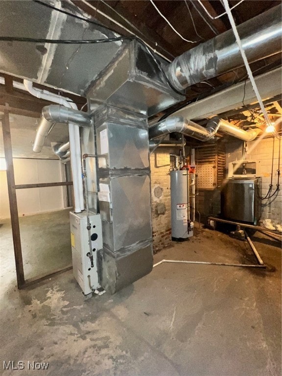 basement with water heater and heating unit