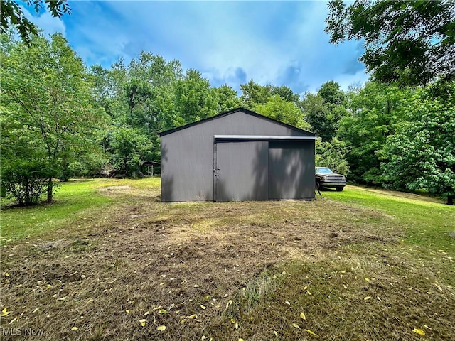 view of outdoor structure with a yard