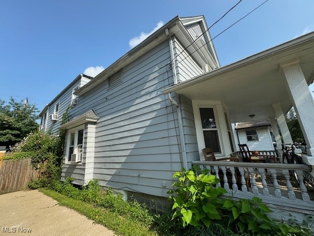 view of property exterior featuring covered porch