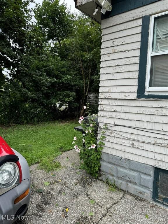 view of home's exterior featuring a yard