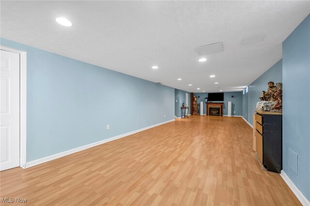 unfurnished living room with light hardwood / wood-style flooring