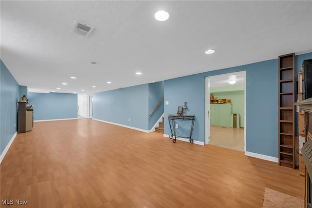 unfurnished living room with light hardwood / wood-style floors