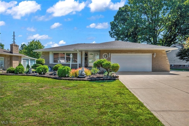 ranch-style home with a front yard and a garage