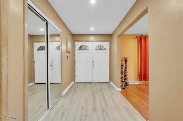 foyer with light hardwood / wood-style flooring