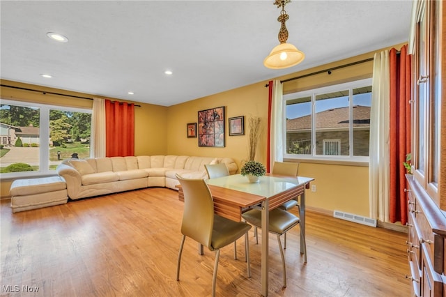 dining area featuring light wood-type flooring