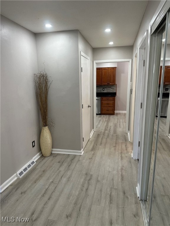 hallway featuring light hardwood / wood-style floors