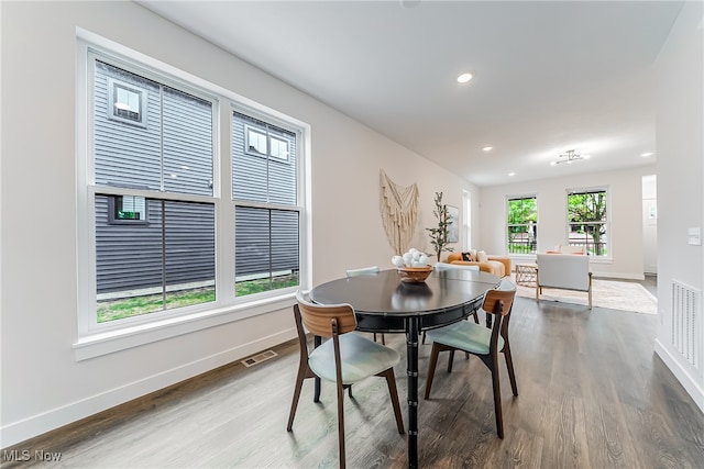 dining area with hardwood / wood-style floors