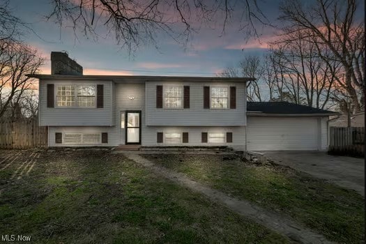 bi-level home featuring a garage