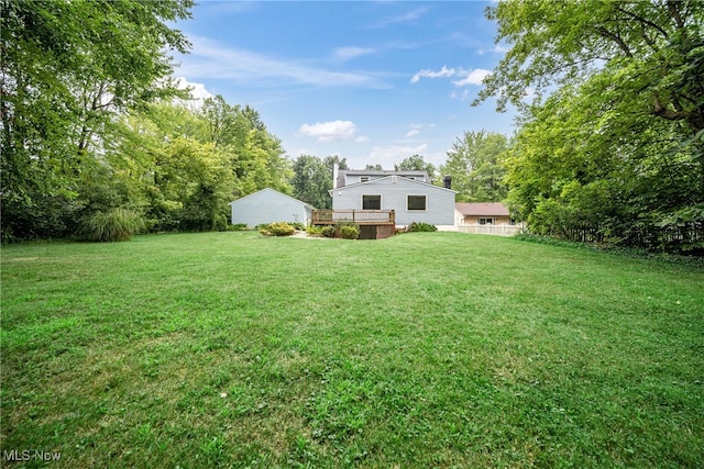 view of yard with a wooden deck