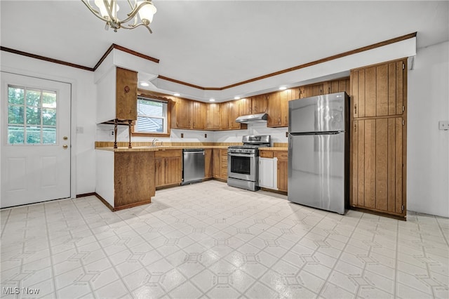 kitchen with crown molding, stainless steel appliances, light tile patterned floors, a notable chandelier, and sink