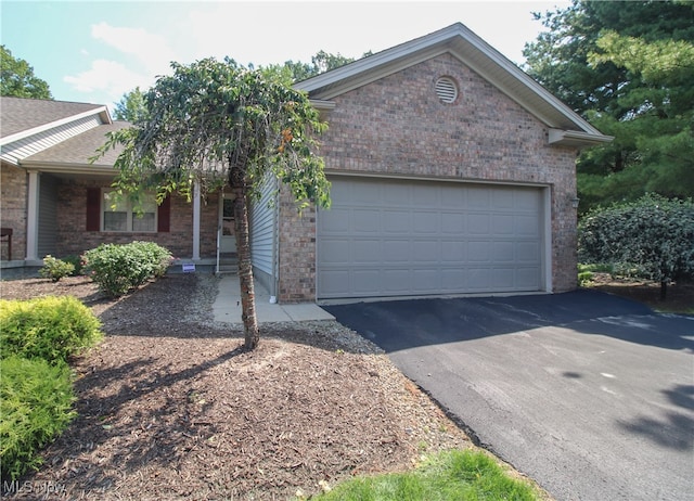 ranch-style home featuring a garage