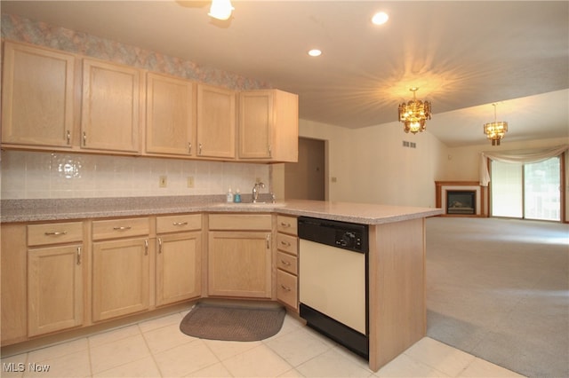 kitchen with light carpet, light brown cabinets, and dishwasher