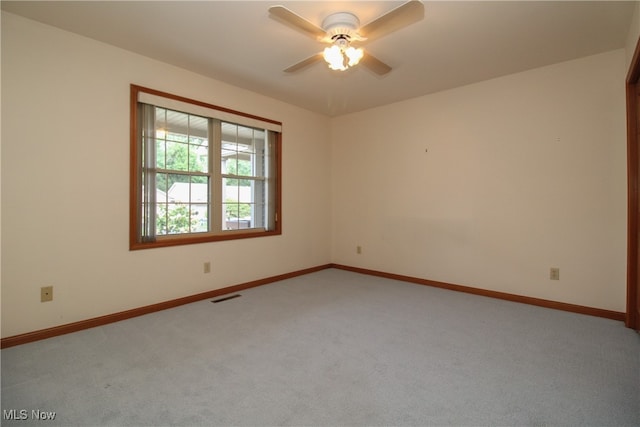 carpeted empty room with ceiling fan