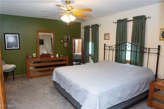 bedroom with ceiling fan and carpet flooring