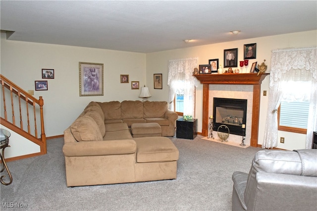 living room featuring a fireplace and carpet flooring