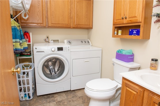 clothes washing area with tile patterned floors and separate washer and dryer