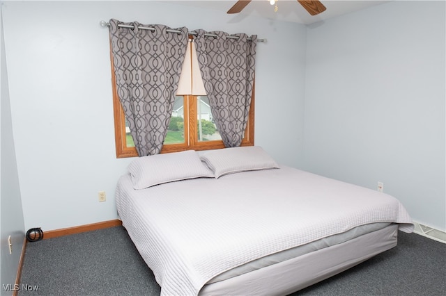 bedroom featuring ceiling fan and carpet