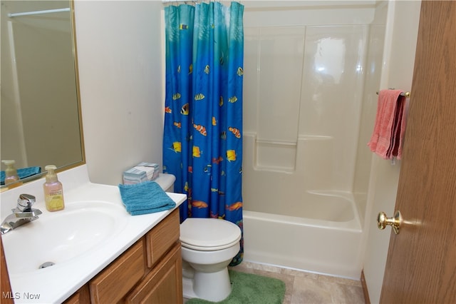 full bathroom featuring shower / bathtub combination with curtain, vanity, tile patterned flooring, and toilet