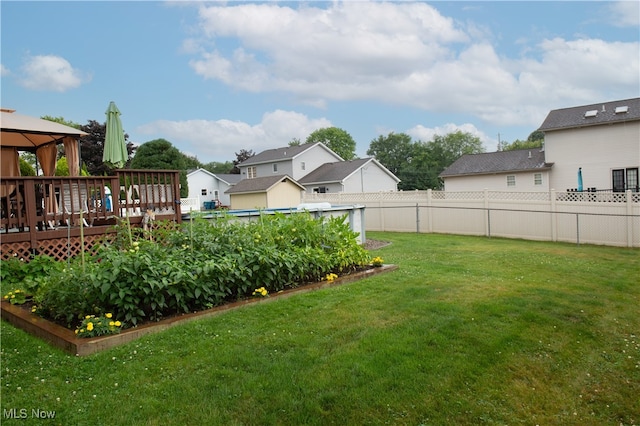 view of yard with a gazebo and a wooden deck