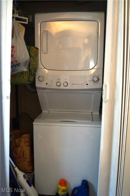 laundry room featuring stacked washer and dryer