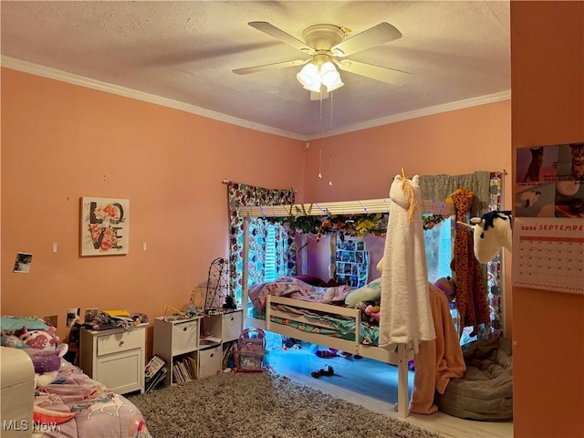 carpeted bedroom with ceiling fan, crown molding, and a textured ceiling