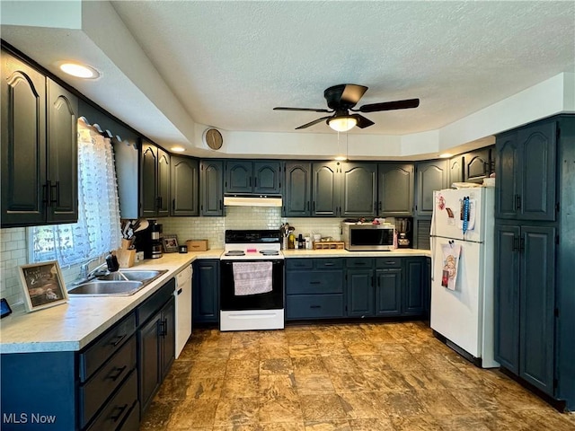 kitchen featuring sink, ceiling fan, electric range oven, decorative backsplash, and white fridge