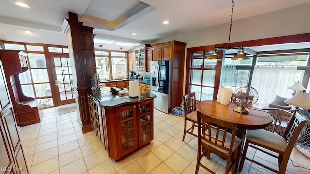 kitchen with stainless steel fridge, pendant lighting, french doors, and light tile patterned floors