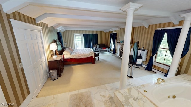 bedroom featuring decorative columns, light carpet, and vaulted ceiling with beams