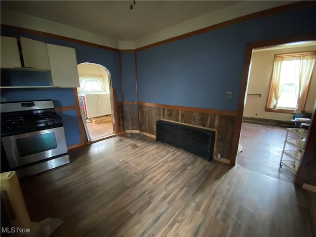 kitchen with hardwood / wood-style flooring and stainless steel gas stove