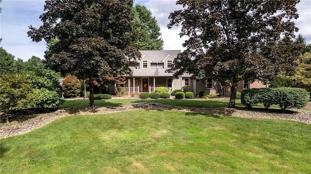 view of front of home featuring covered porch and a front yard