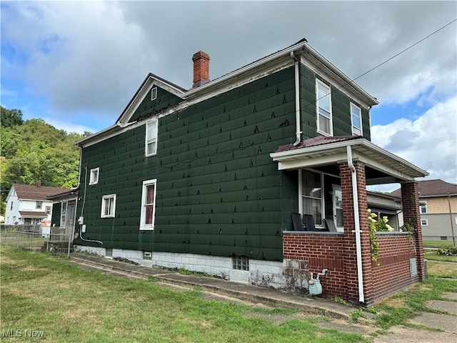 view of home's exterior featuring a lawn