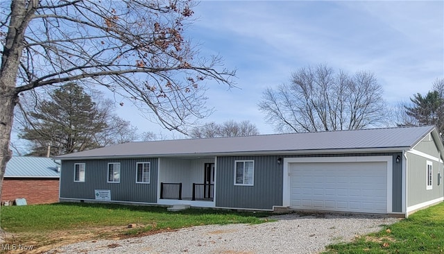 view of front of home with a garage and a front yard