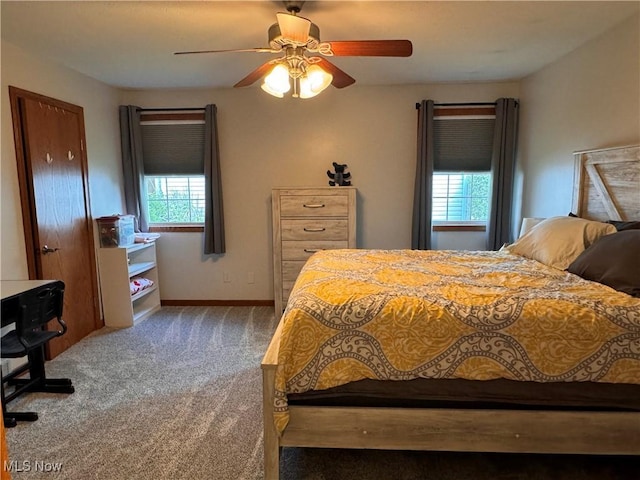 bedroom featuring dark carpet and ceiling fan