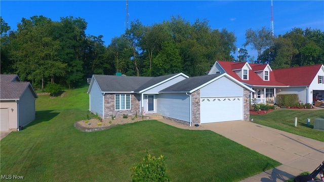 view of front of house with a garage and a front lawn