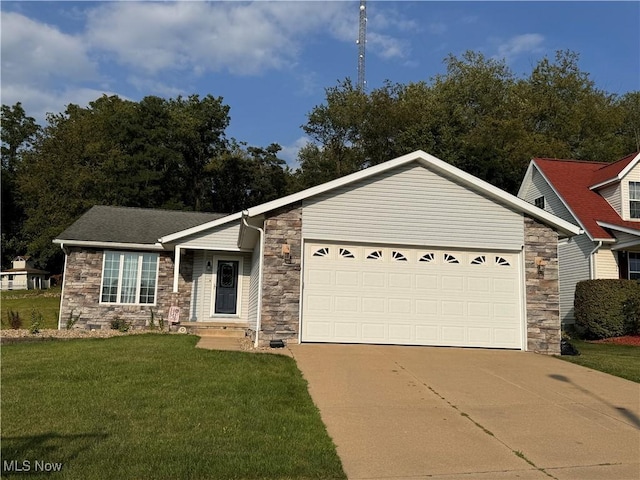 view of front of property featuring a front lawn and a garage