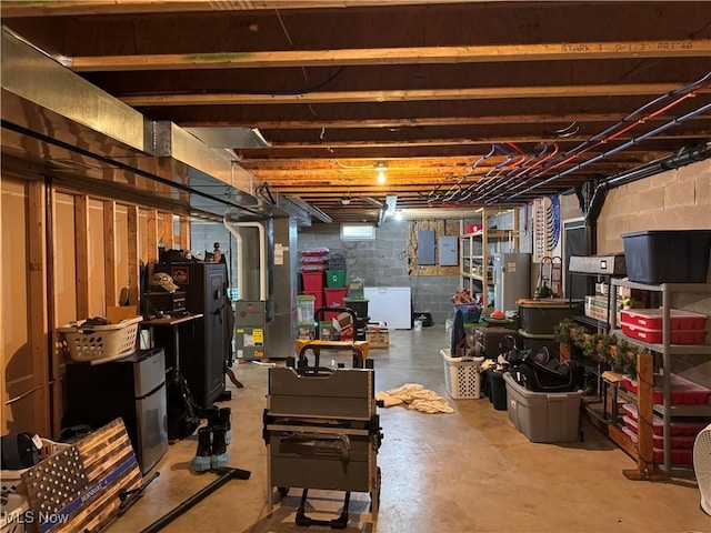 basement featuring fridge and white refrigerator