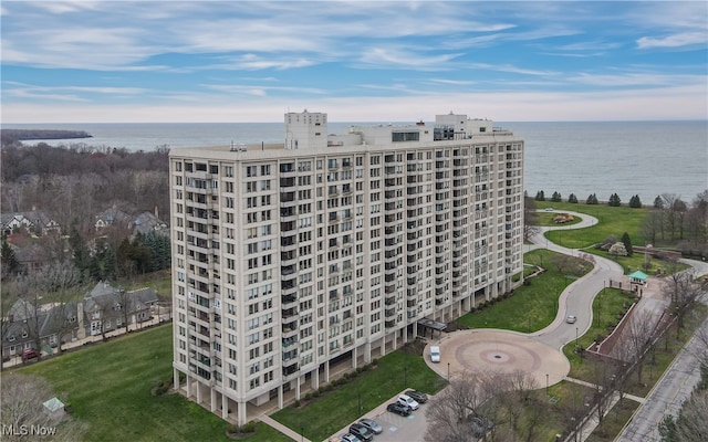 birds eye view of property with a water view