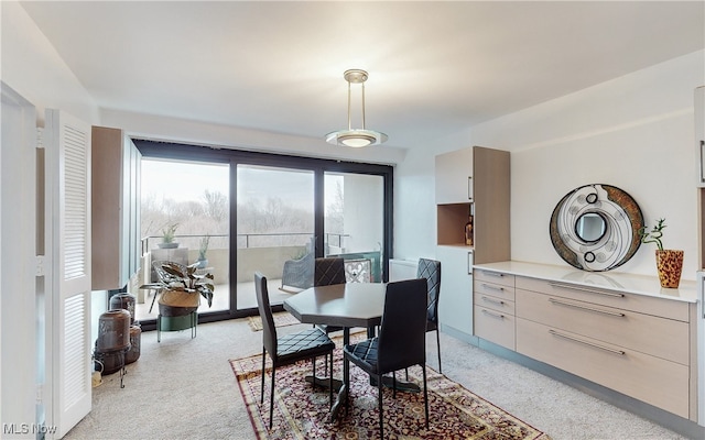 dining area with light colored carpet