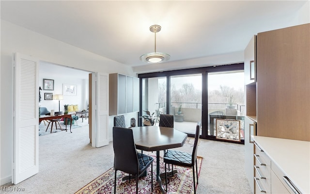 dining area with light carpet