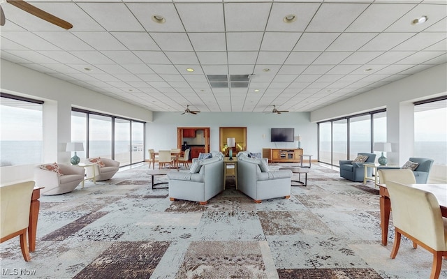 living room featuring recessed lighting, ceiling fan, and a wealth of natural light