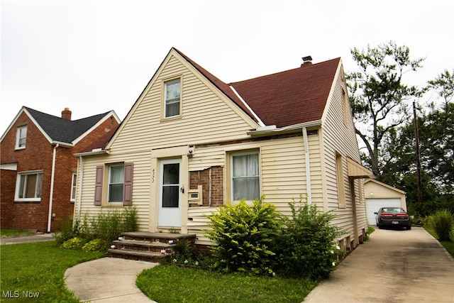 view of front of house with an outdoor structure and a garage