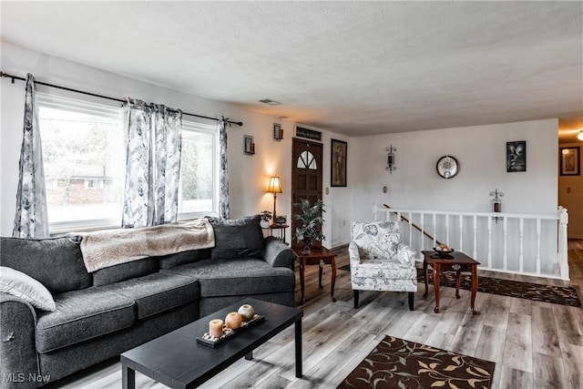 780 Mcgill Rd, Vincent, OH 45784 - living area featuring a textured ceiling, wood finished floors, and visible vents