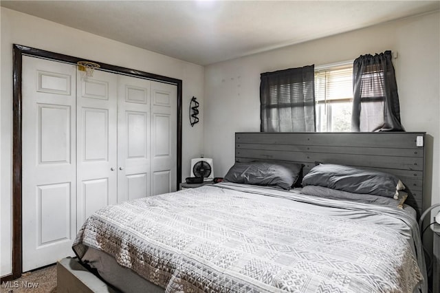 carpeted bedroom featuring a closet