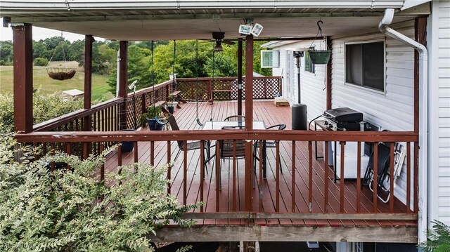 deck featuring a grill