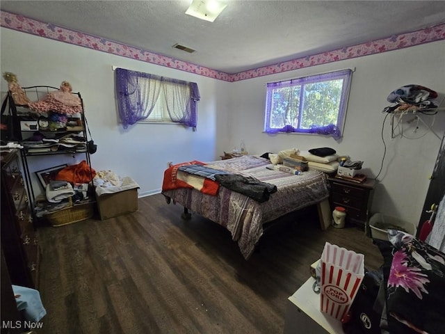 780 Mcgill Rd, Vincent, OH 45784 - bedroom with visible vents, a textured ceiling, and wood finished floors