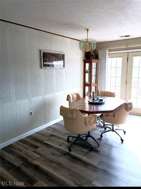 dining space featuring dark hardwood / wood-style flooring