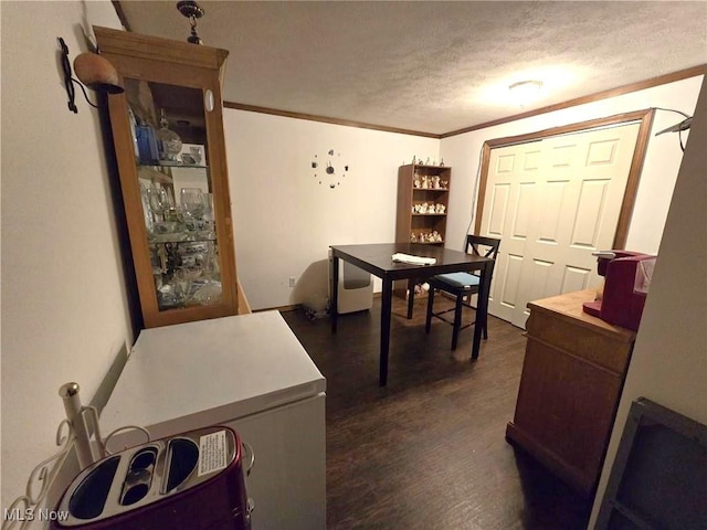 780 Mcgill Rd, Vincent, OH 45784 - dining space featuring ornamental molding, dark wood-type flooring, and a textured ceiling
