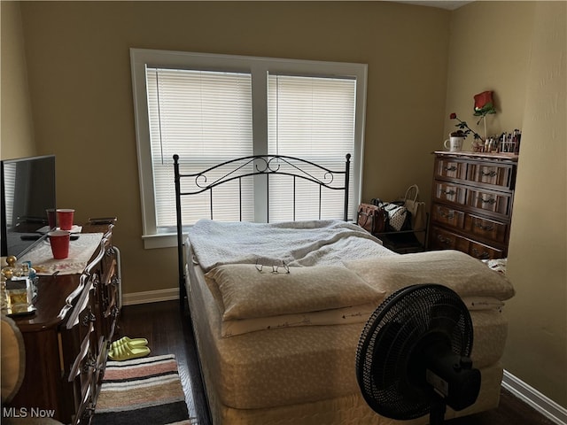 bedroom featuring dark wood-type flooring